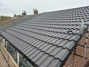 New interlocking concrete tiles installed with dry ridge system on Leeds house