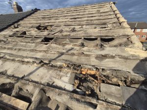 Full re-roof with grey concrete tiles and dry ridge on residential property in Leeds