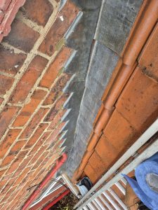 Professional chimney repairs with new flaunching and cap installation in Leeds