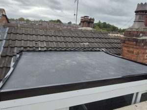 Slate roof repair with new Velux skylight on Victorian property in Leeds