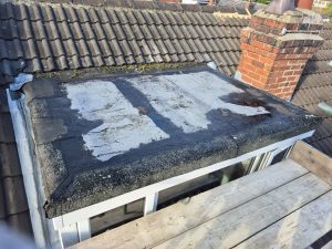 Dormer window and Velux installation on slate terraced house roof in Leeds