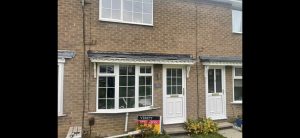 New GRP flat roof on porch canopy showing professional finish in Leeds