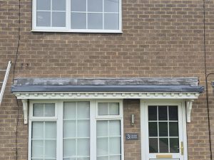 Completed GRP fibreglass porch roof installation with lead trim in Leeds